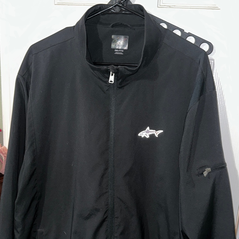 Greg Norman Collection Black Windbreaker with Shark Emblem